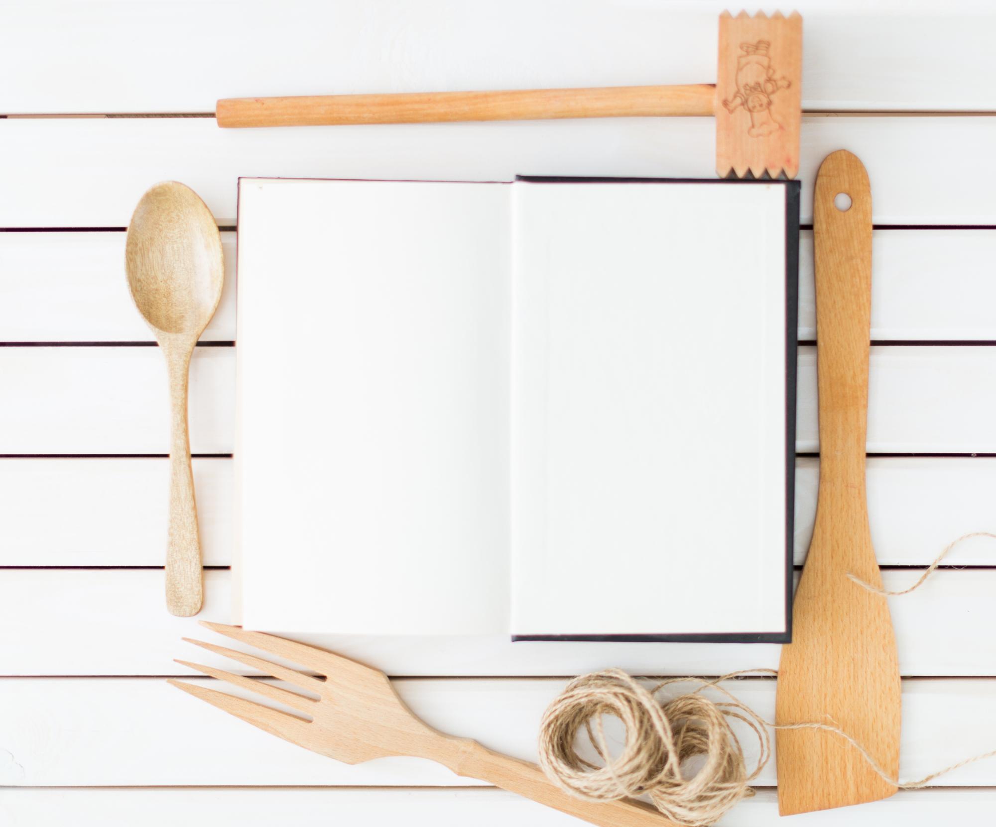 studio counter with open notebook and measuring spoons